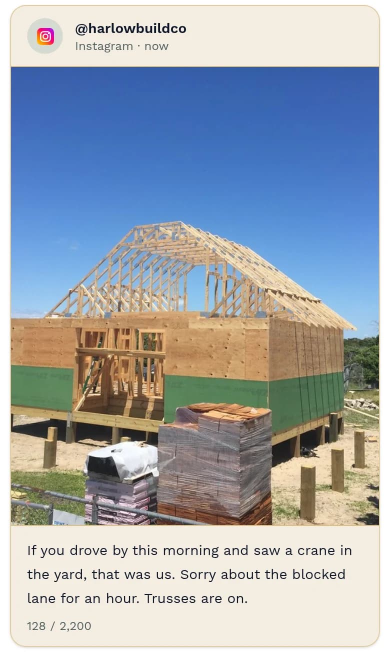 Instagram post preview from @harlowbuildco: a framed house with its roof trusses up against a blue sky, pallets of roofing in front. Caption: “If you drove by this morning and saw a crane in the yard, that was us. Sorry about the blocked lane for an hour. Trusses are on.” 128 of 2,200 characters.