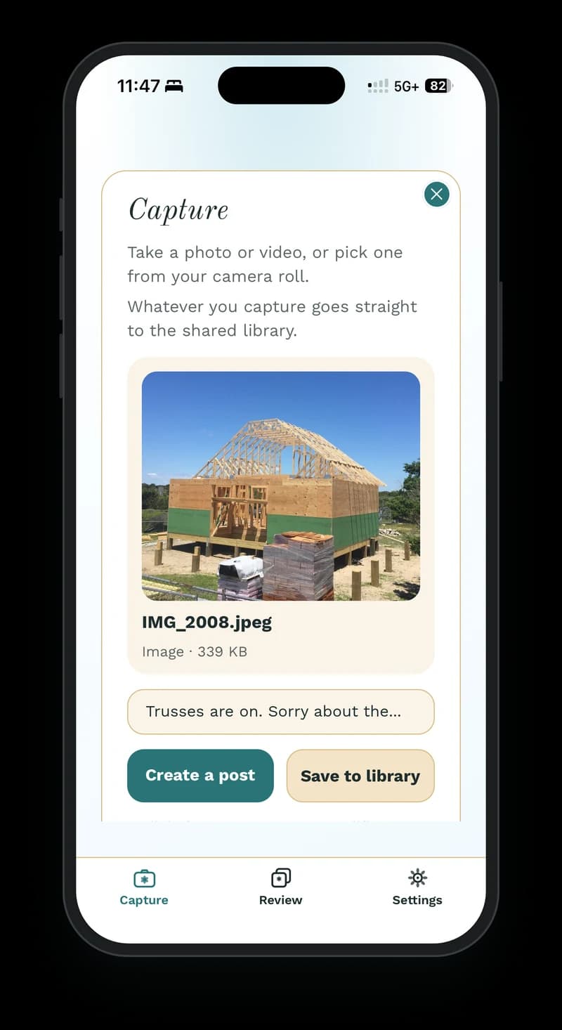 The Wallflower phone app on an iPhone, open to Capture with a photo of a house framed up with its roof trusses on, the caption “Trusses are on. Sorry about the…”, and buttons to create a post or save it to the library.