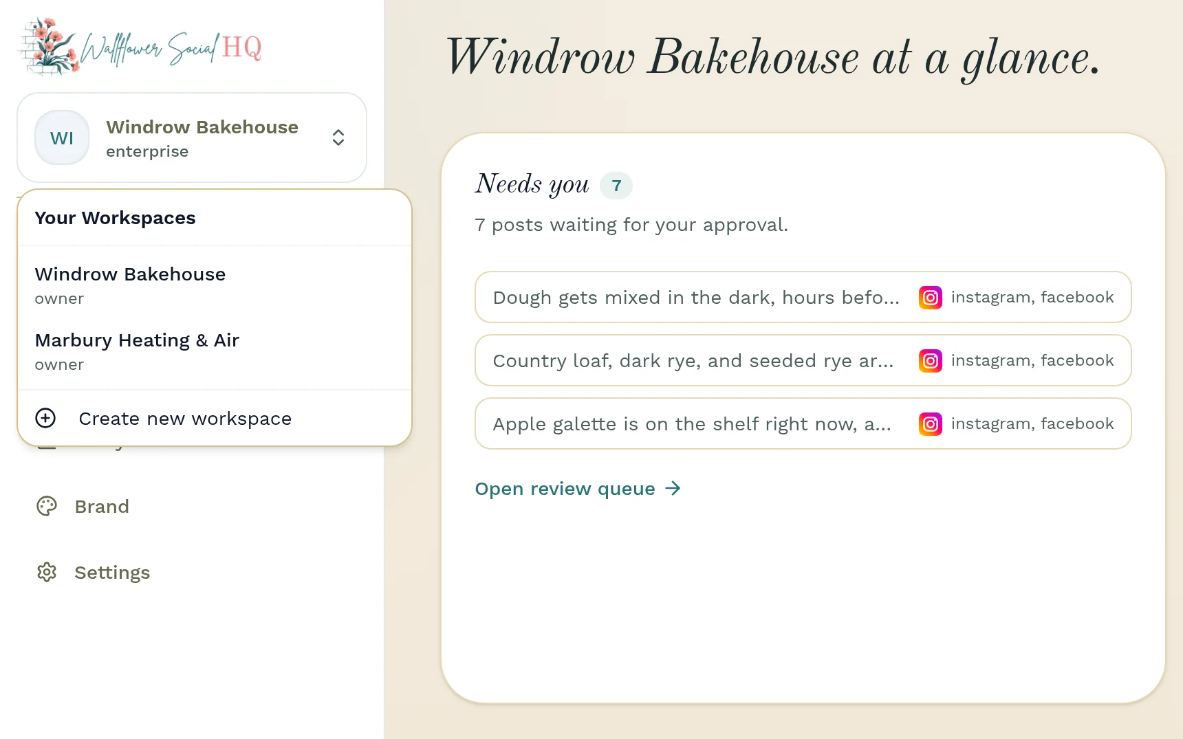 The workspace switcher open over the Windrow Bakehouse dashboard: Your Workspaces lists Windrow Bakehouse and Marbury Heating & Air, both as owner, and Create new workspace. Beside it, “Windrow Bakehouse at a glance” shows Needs you with 7 posts waiting for approval.
