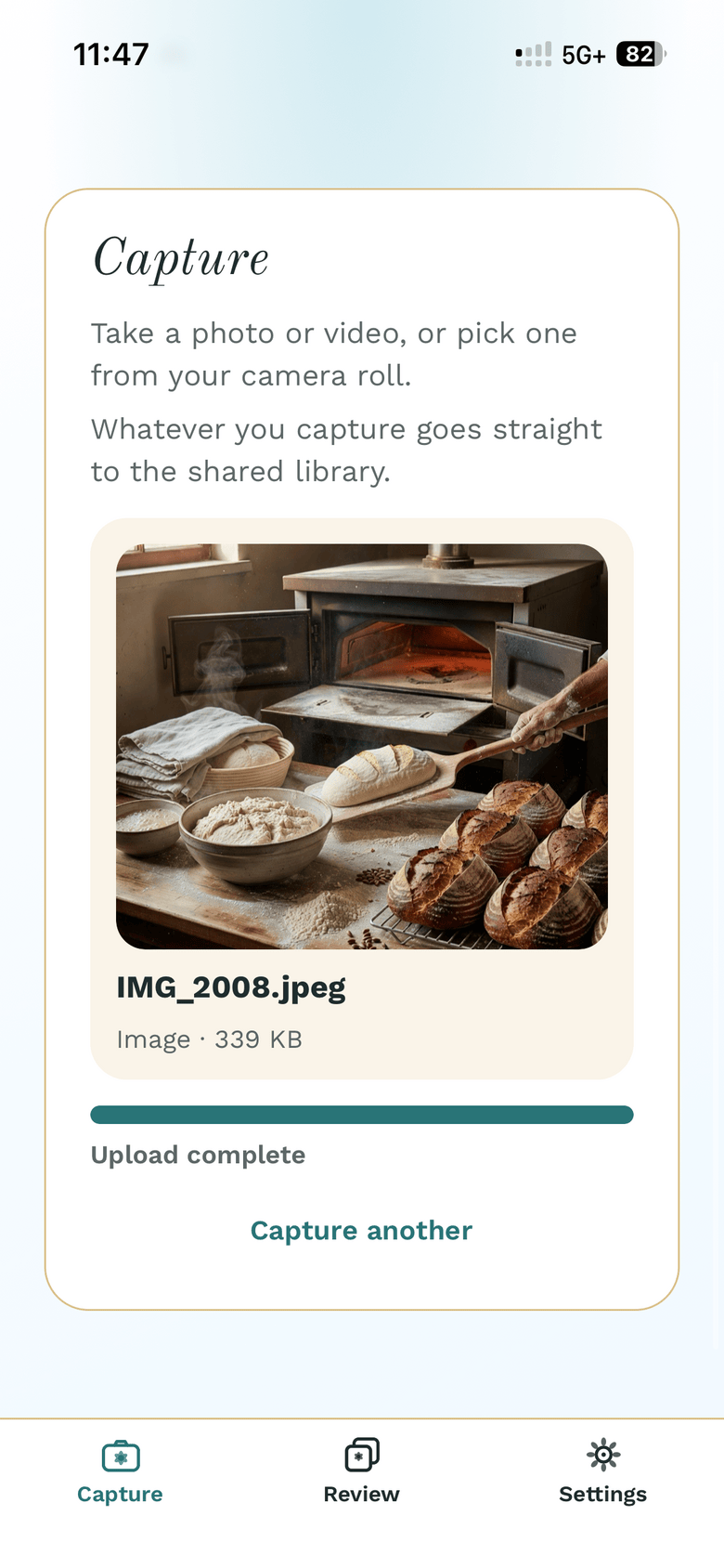 Progress bar at 100% with "Upload complete" and the Capture another button